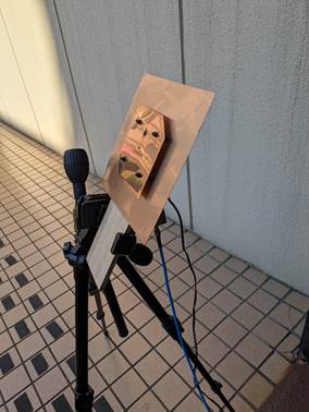 Home-made L-band patch antenna mounted on a camera tripod. The antenna is made using a 0.5mm thick copper sheet as you can easily find at home centers.